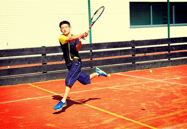 ISSFT student playing tennis