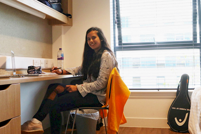 ISSFT student siting in their room